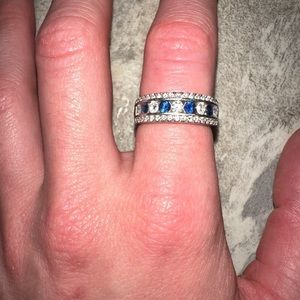 Diamond a sapphire band 14k white gold size 5 or 6. It can be resized